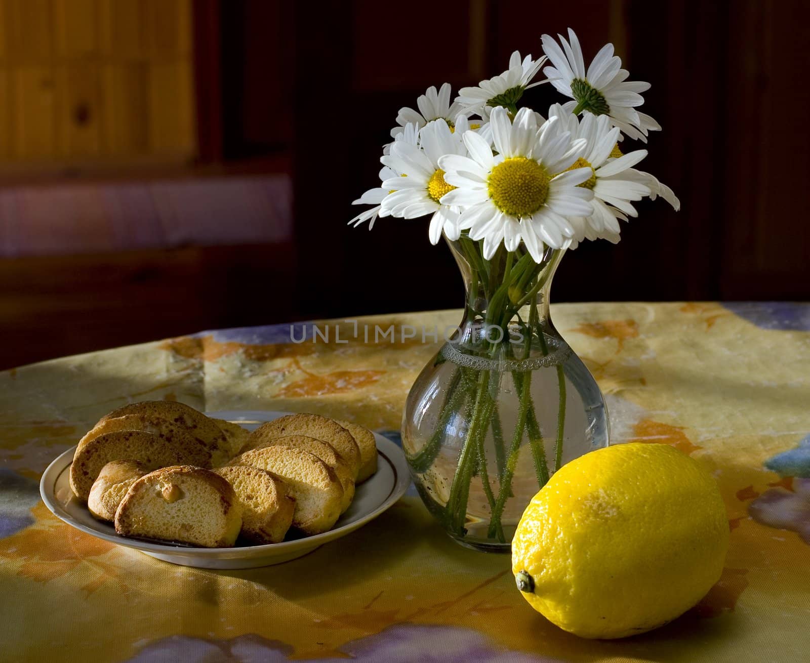 Still life with flowers, baking and lemon.