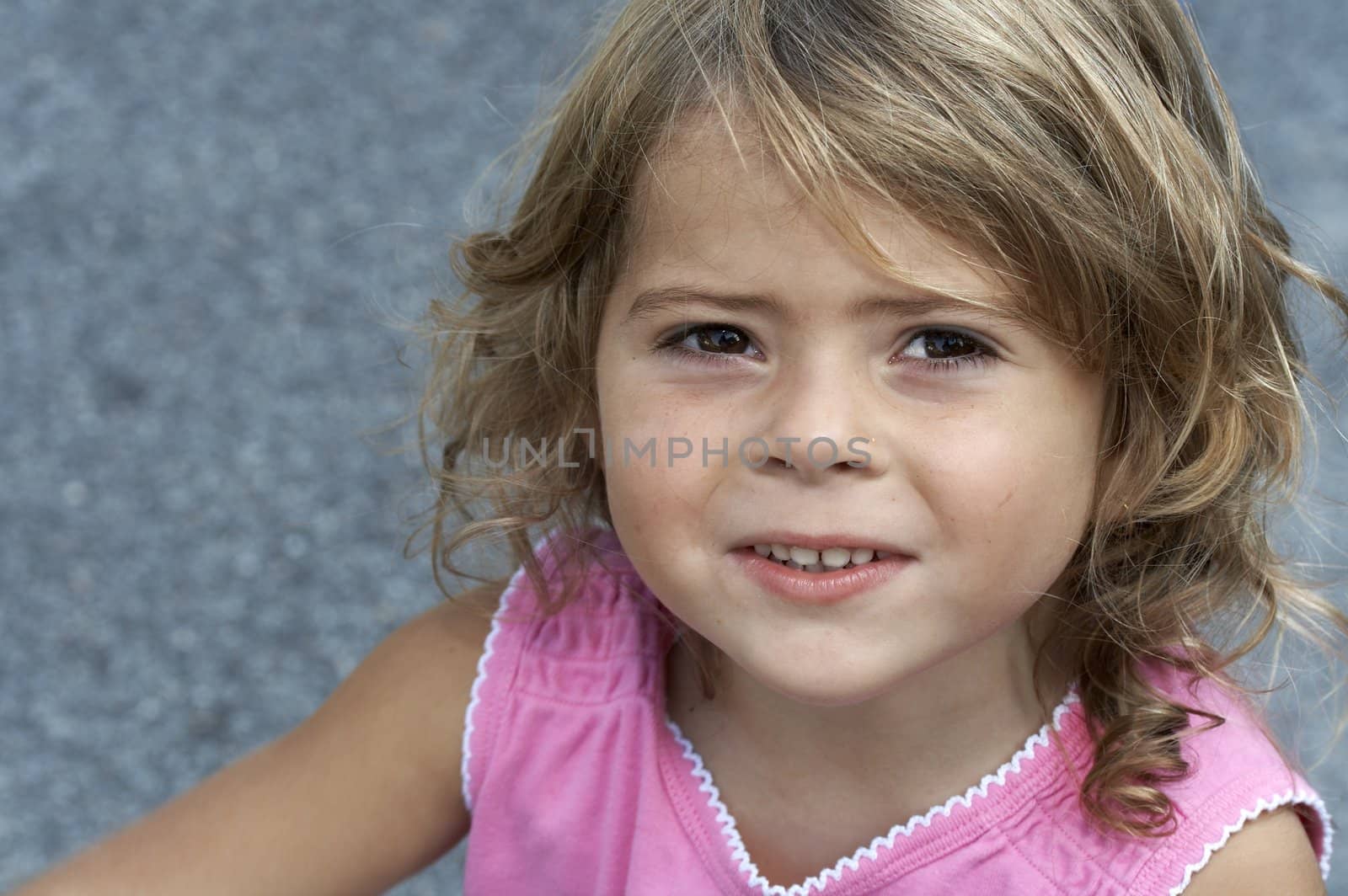 a picture of a cute little girl smiling