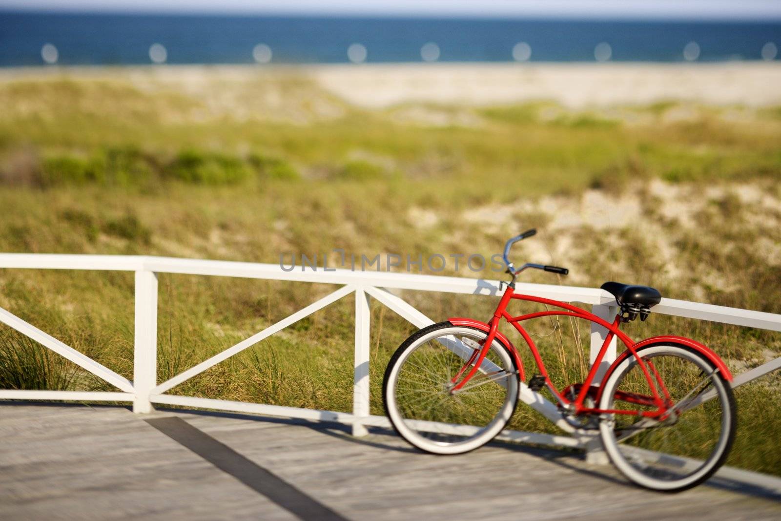 Red beach cruiser bicycle. by iofoto