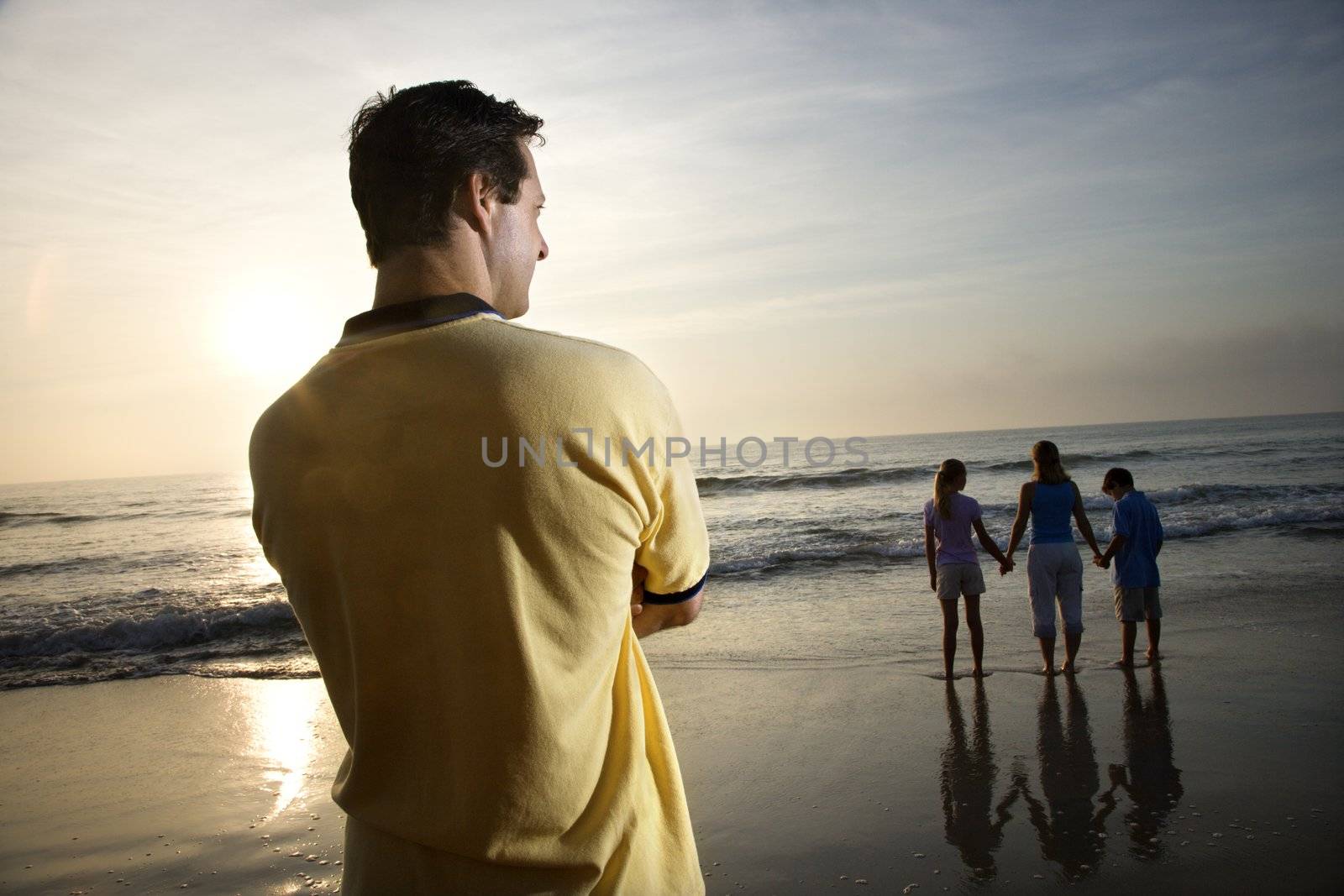 Family at beach. by iofoto