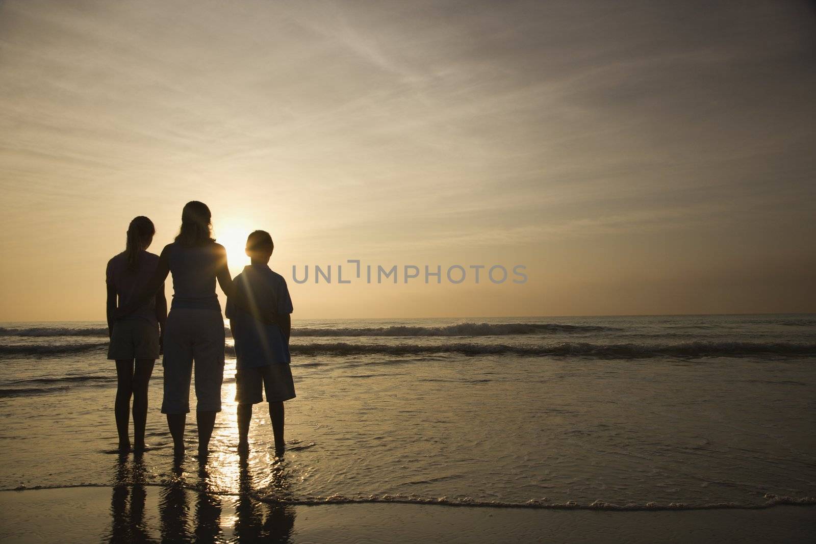 Family at beach. by iofoto