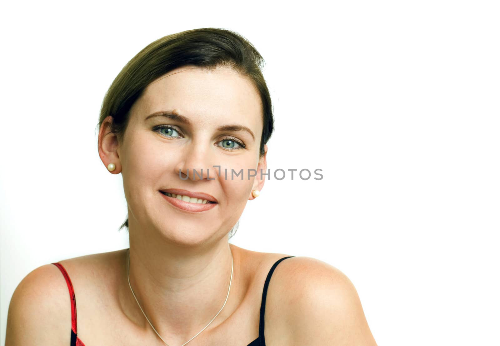 Portrait of smiling young woman on white background.