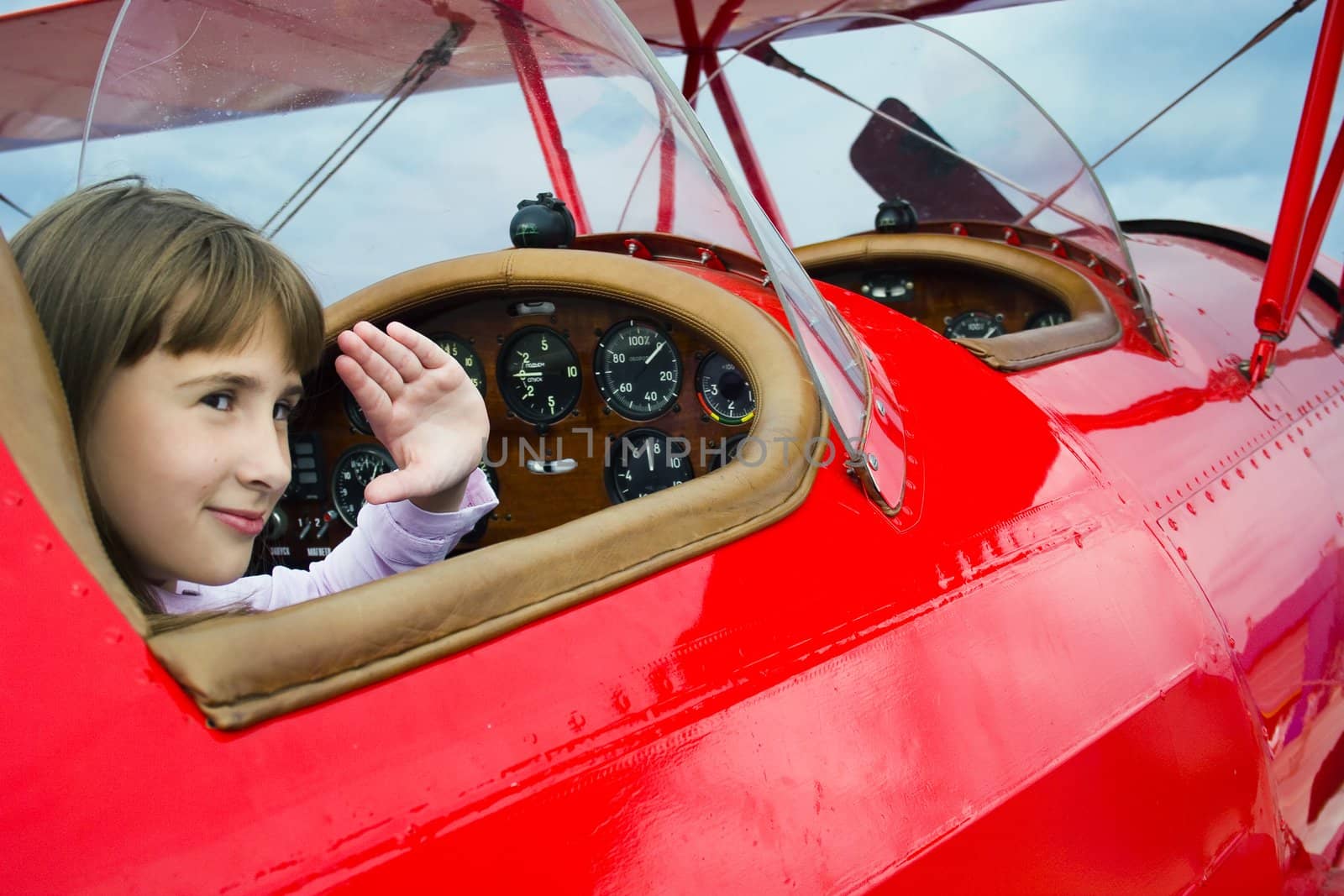 Girl with bag in seat of the plane