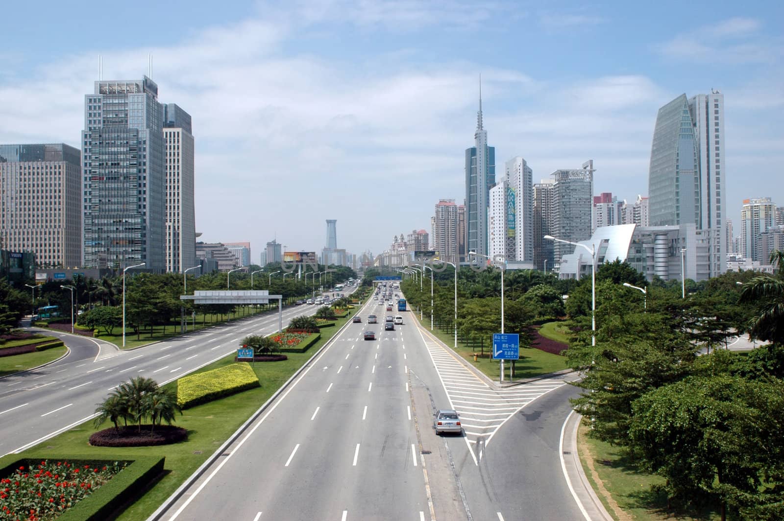 China, Guangdong province, main avenue Shennan Road in Shenzhen city with modern skyscrapers, office buildings.