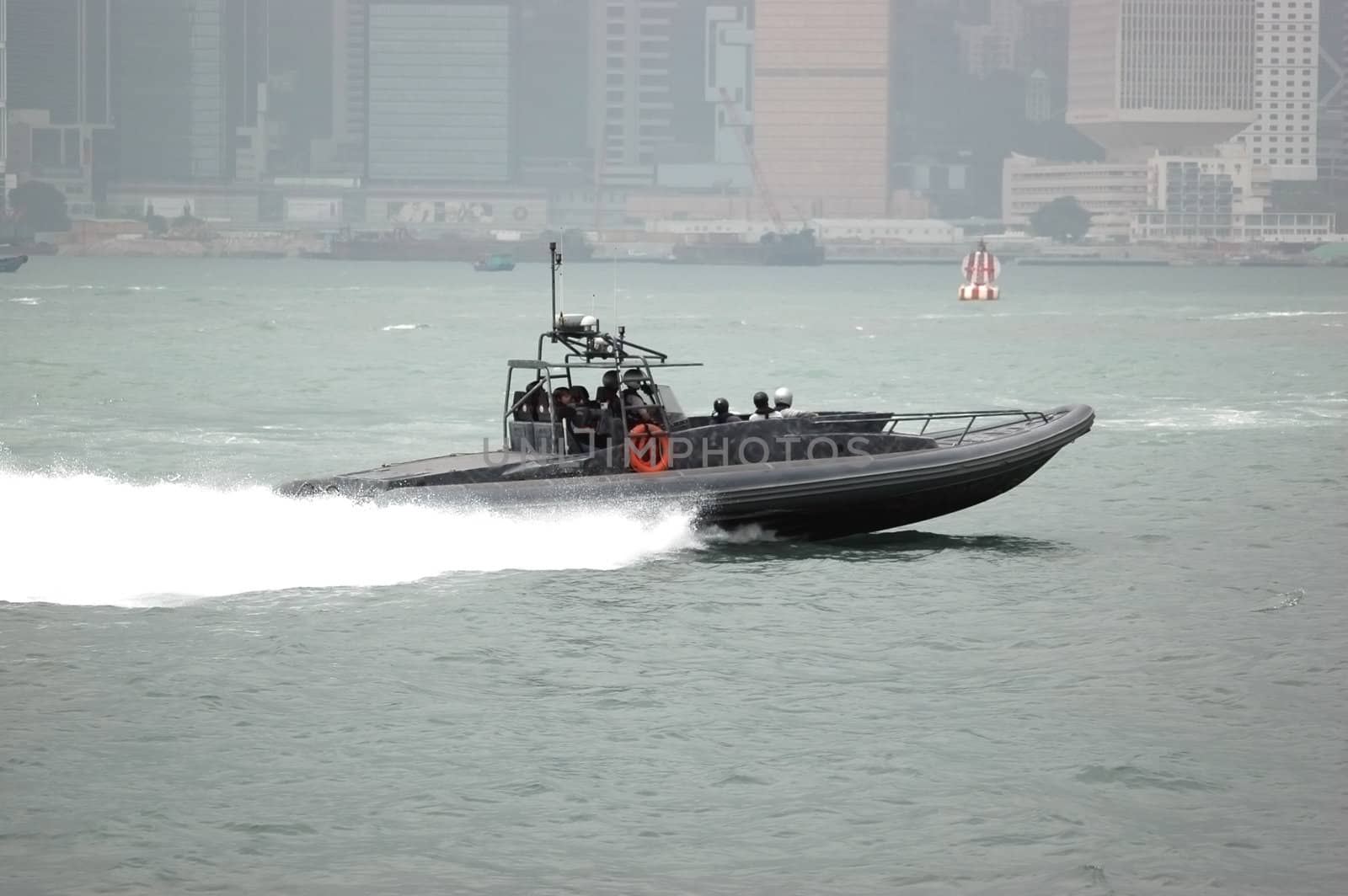 Fast boat in Hongkong harbour with custom's officers for keeping safety and detecting smuggling.