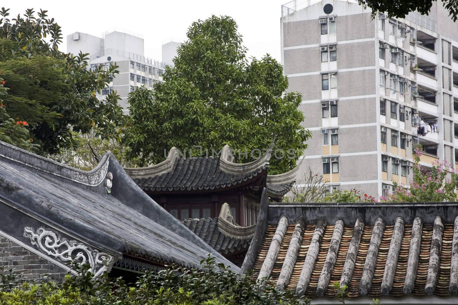 it is a old chinese building and morden building. make a strong comparison to show the living.