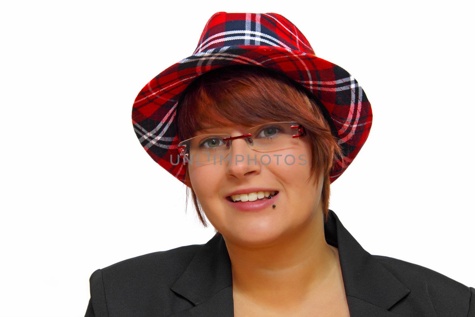 Portrait of an attractive young woman wearing a checkered hat.