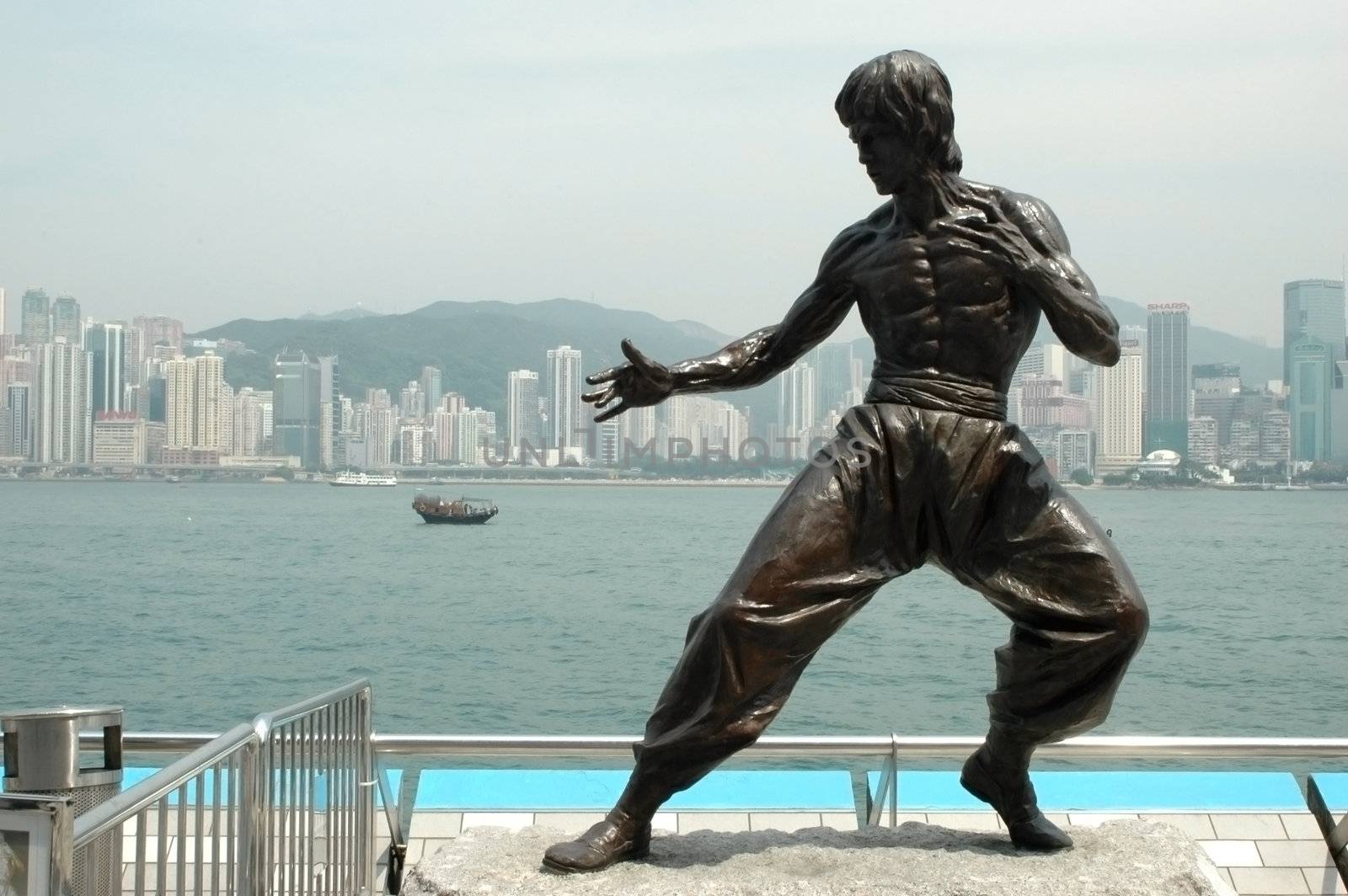 Hongkong - Avenue of Stars with sculpture showing kung-fu fighter.