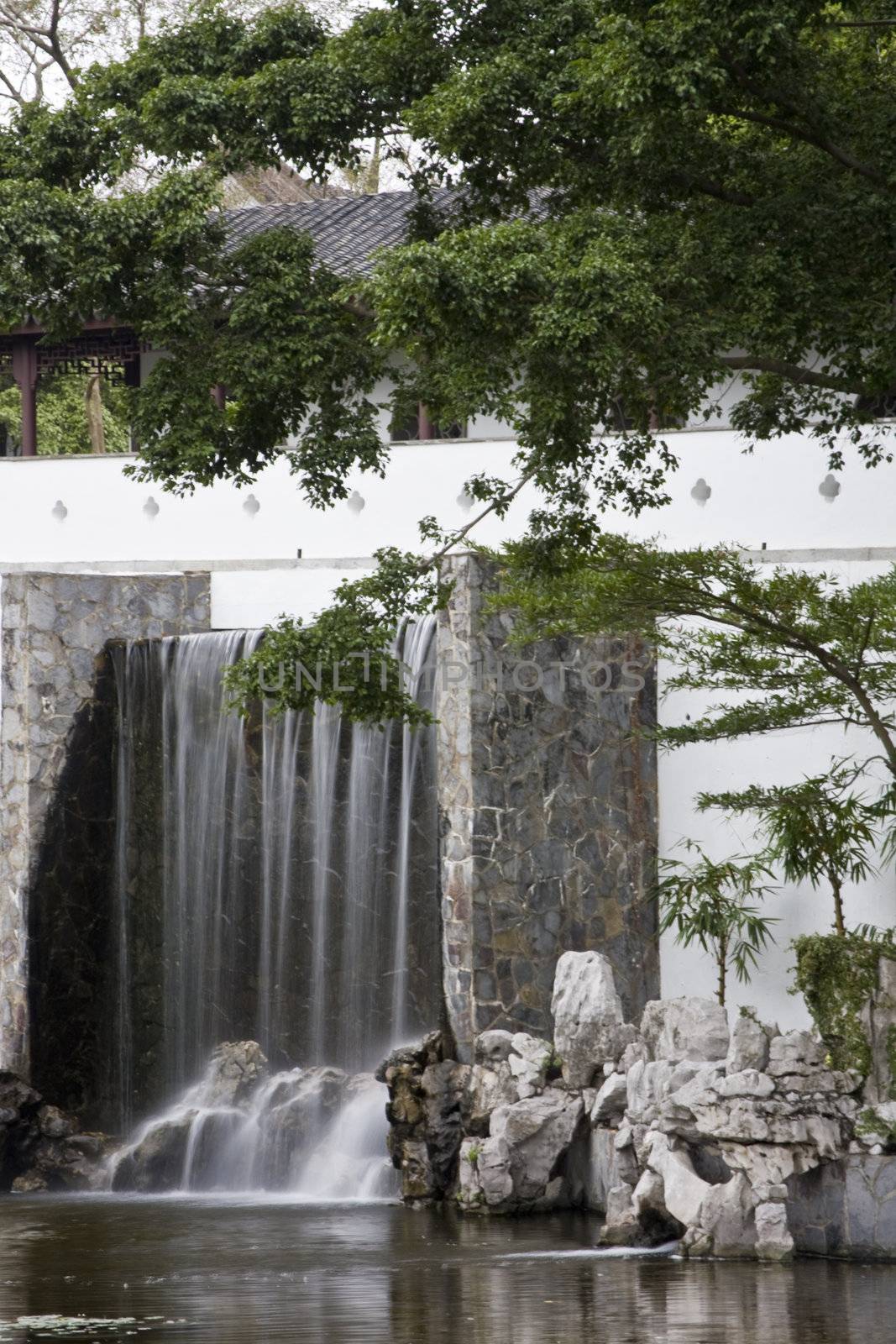 A typical Chinese garden with a pond.