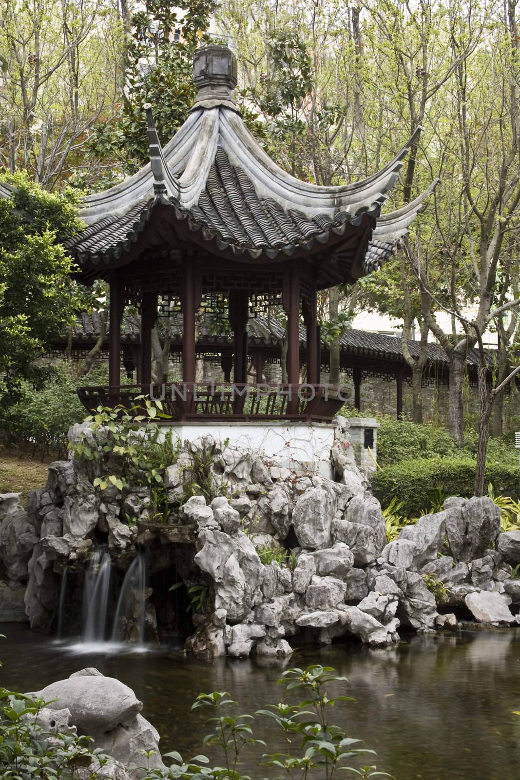 A typical Chinese garden with a pond.