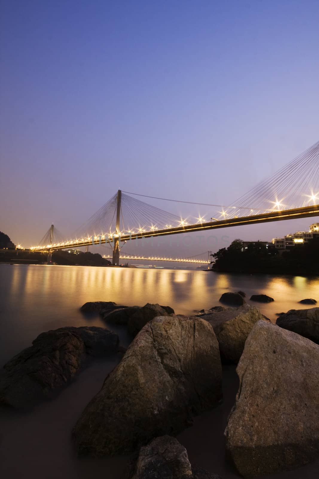 It is beautiful night scenes of Bridge in Hong Kong.