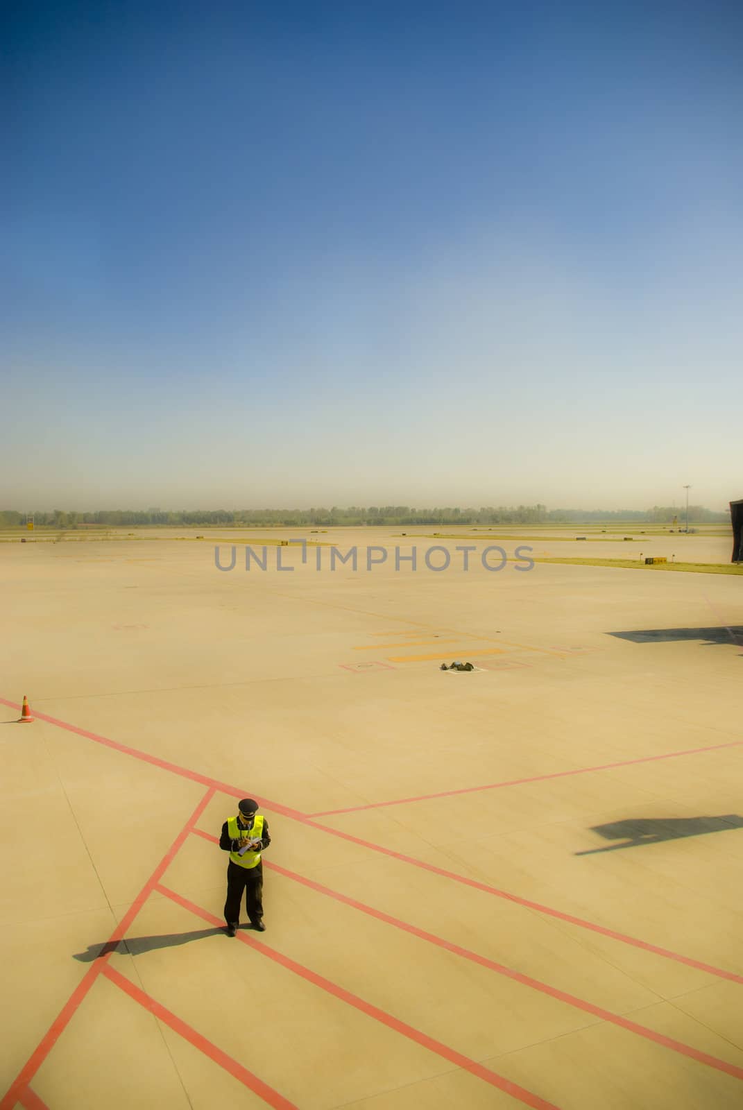 It is airport worker stand alone in airport 