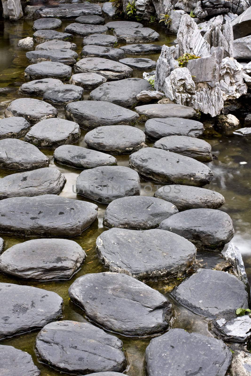 A traditional stone road in a lake in China