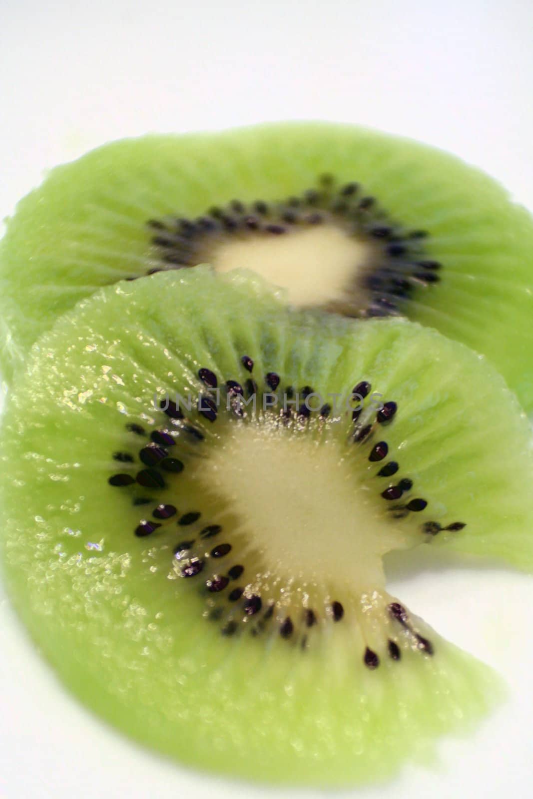 Sliced Kiwi on a white background.