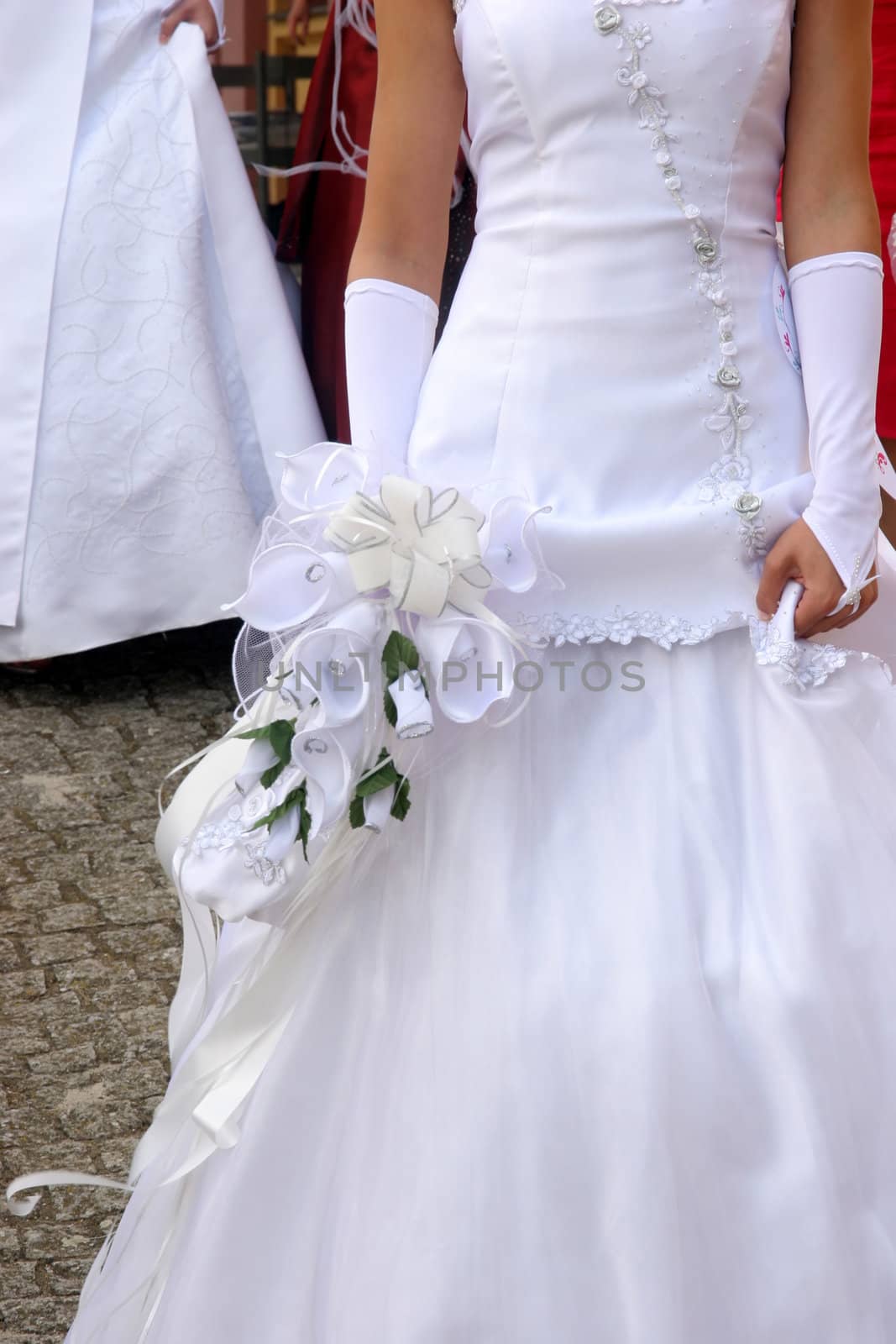 bride in wedding dress and holding bouquet