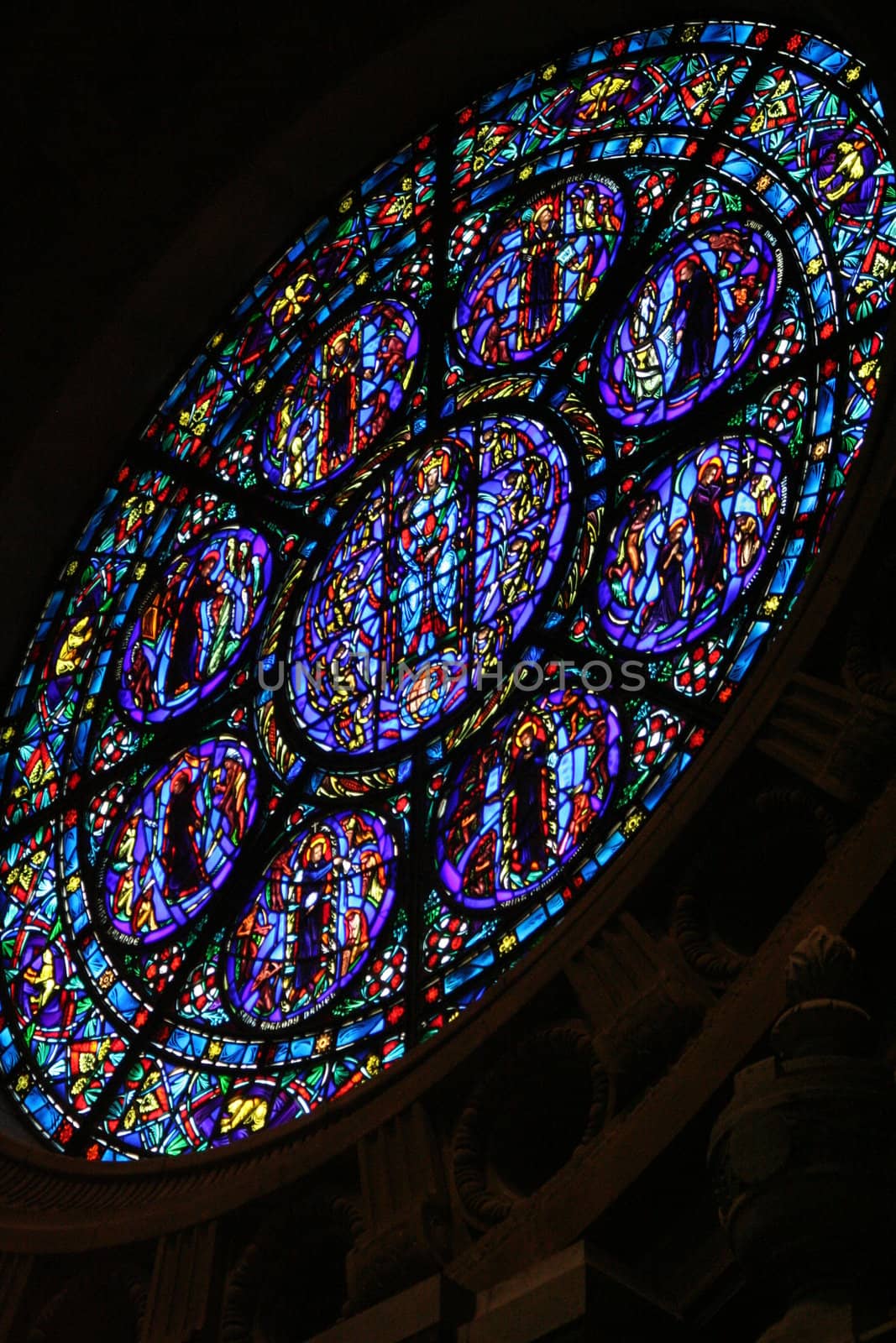 A rose window of a catholic church from the inside.