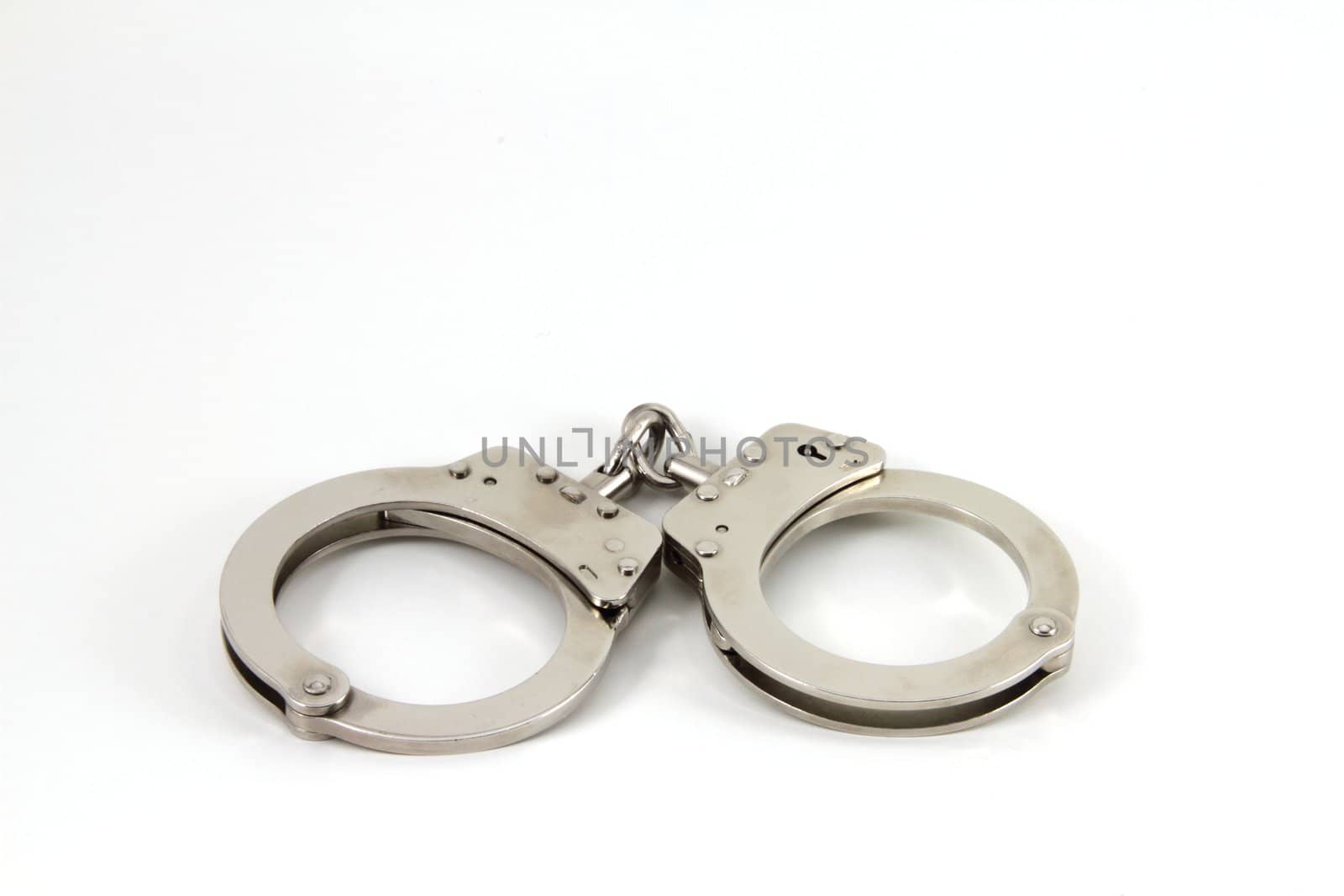 Police handcuffs isolate with copy space.
