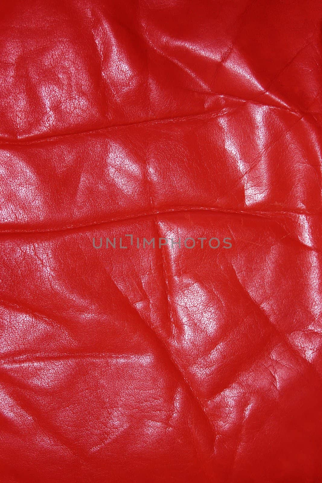 Wrinkled and worn red leather