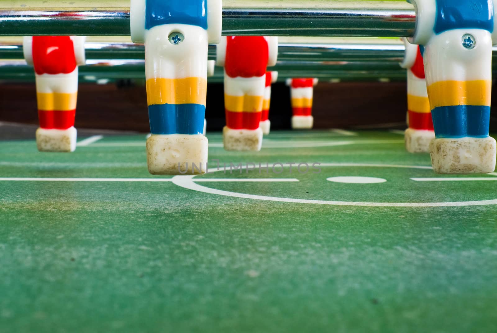 Close up view of plastic players in a football table