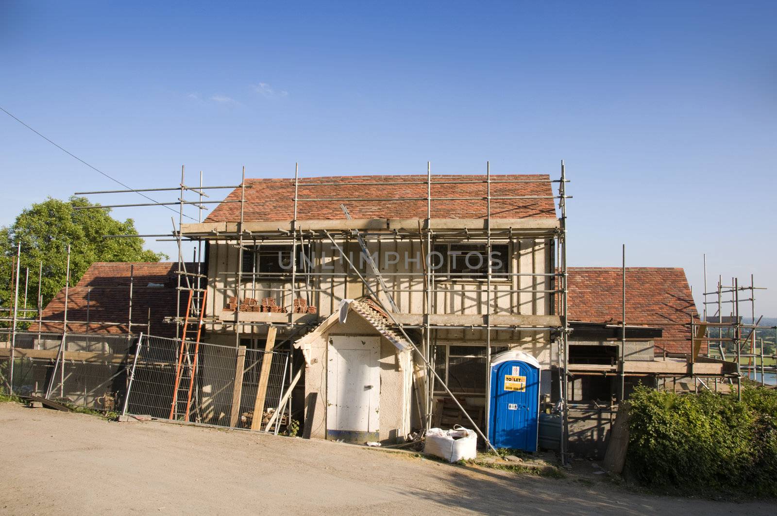 Scaffolding around a new house in the countryside