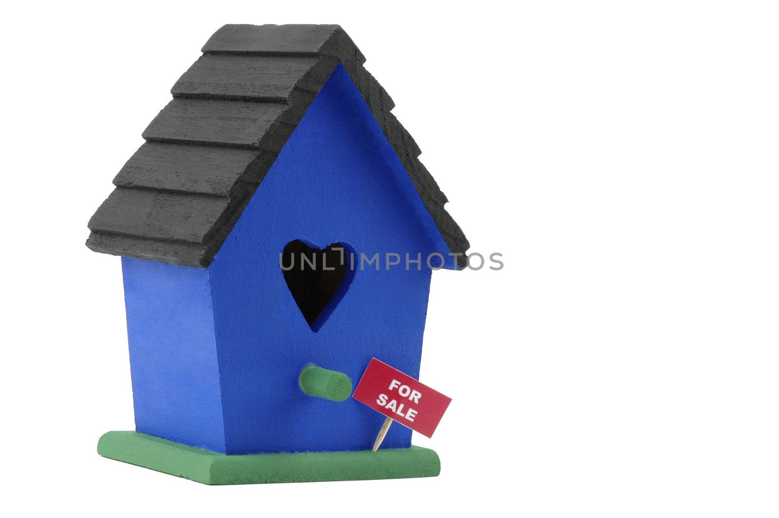 Birdhouse with a for sale sign on a white background,