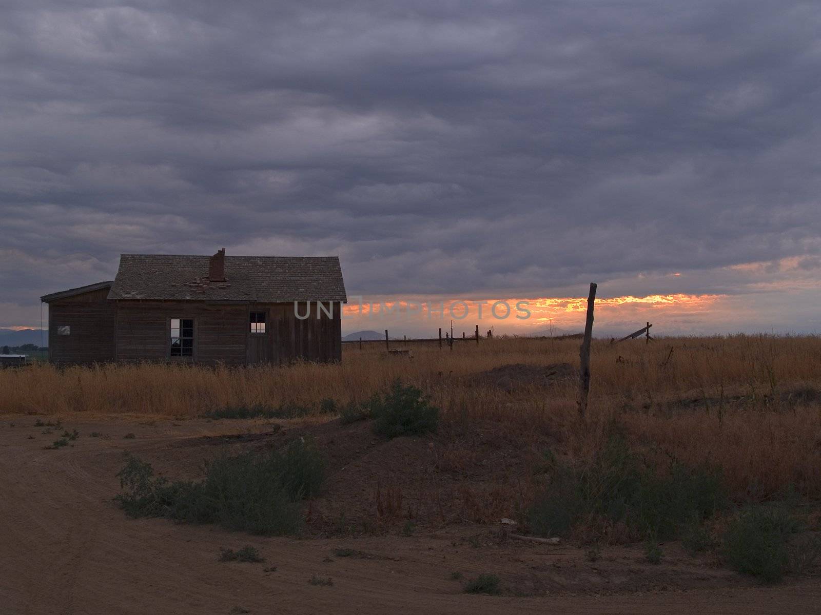 old farm shack under a thunderstorm on the prairie of Eastern Colorado