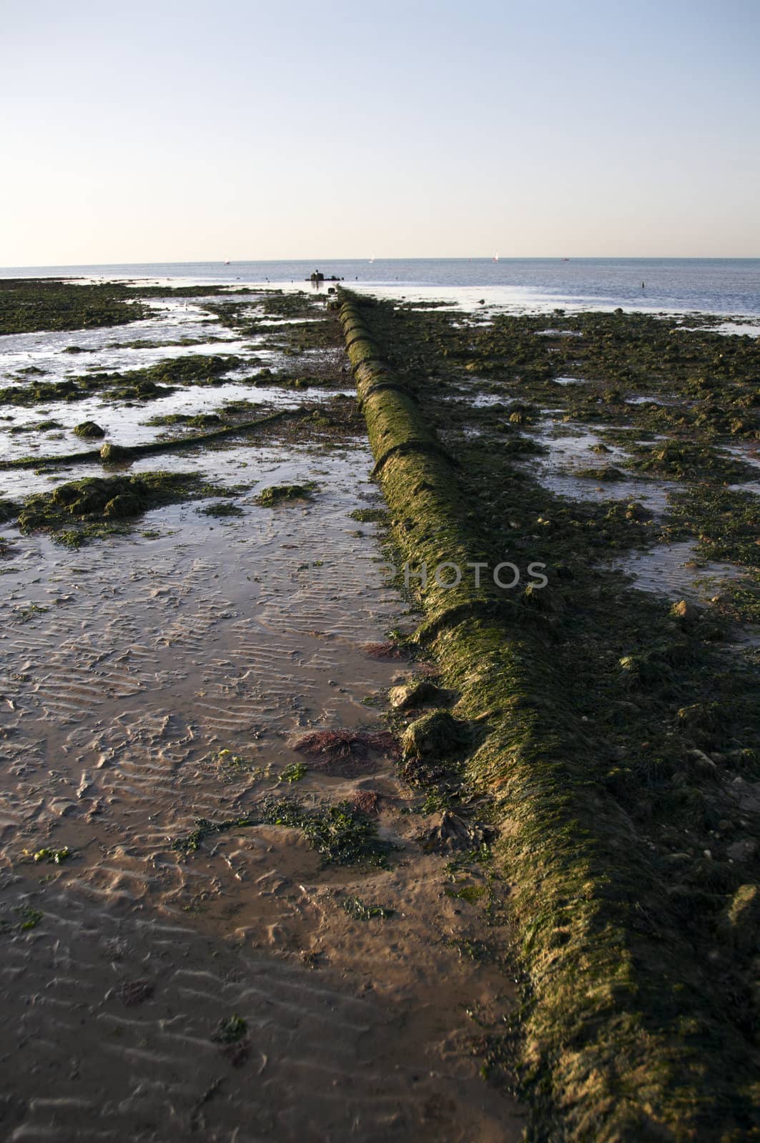 A view from Margate  beach in the late afternoon with a pipe in the foreground