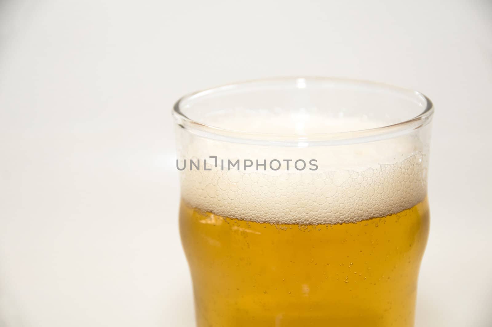 A pint of beer isolated on a white background