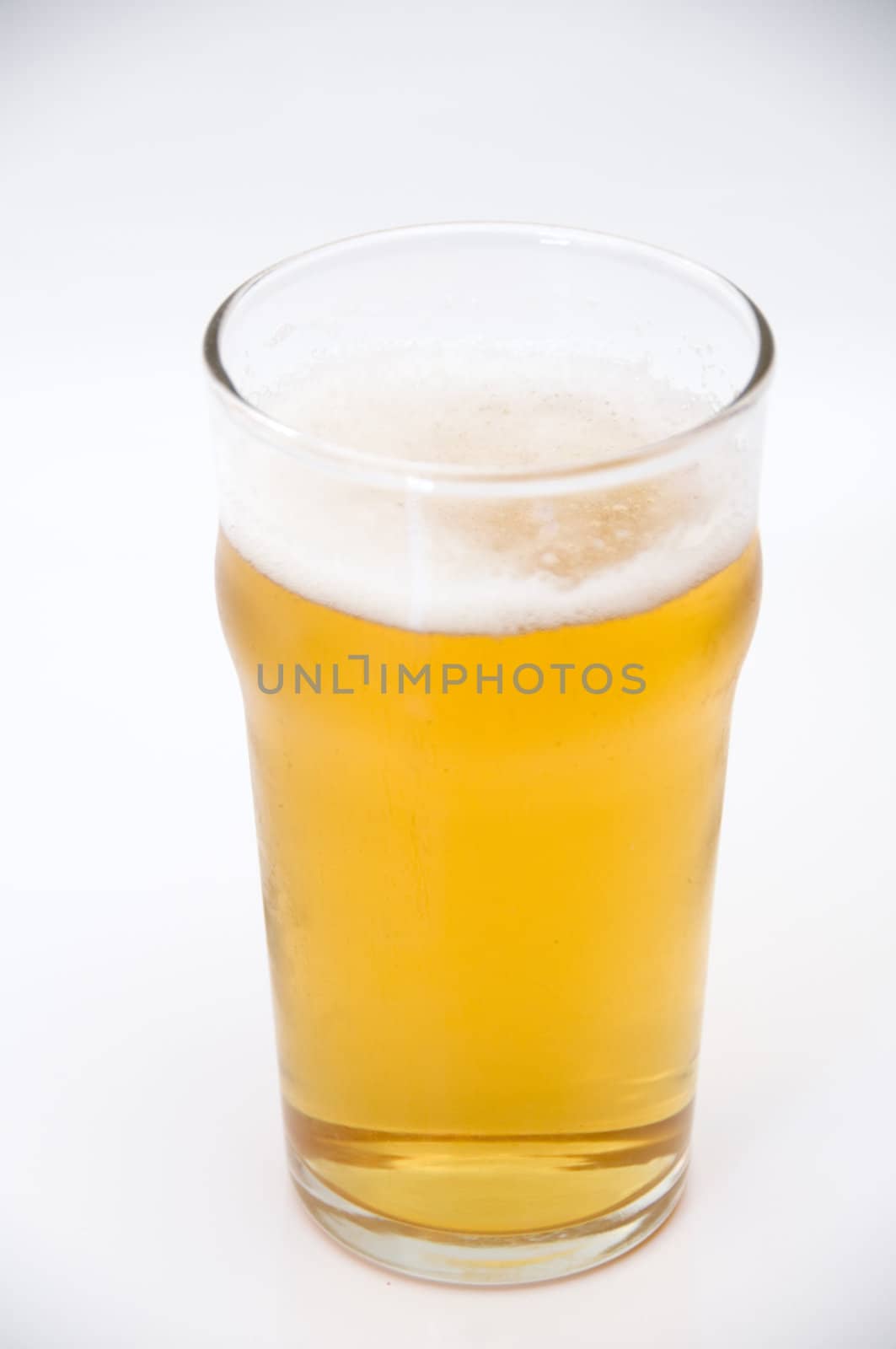 A pint of beer isolated on a white background