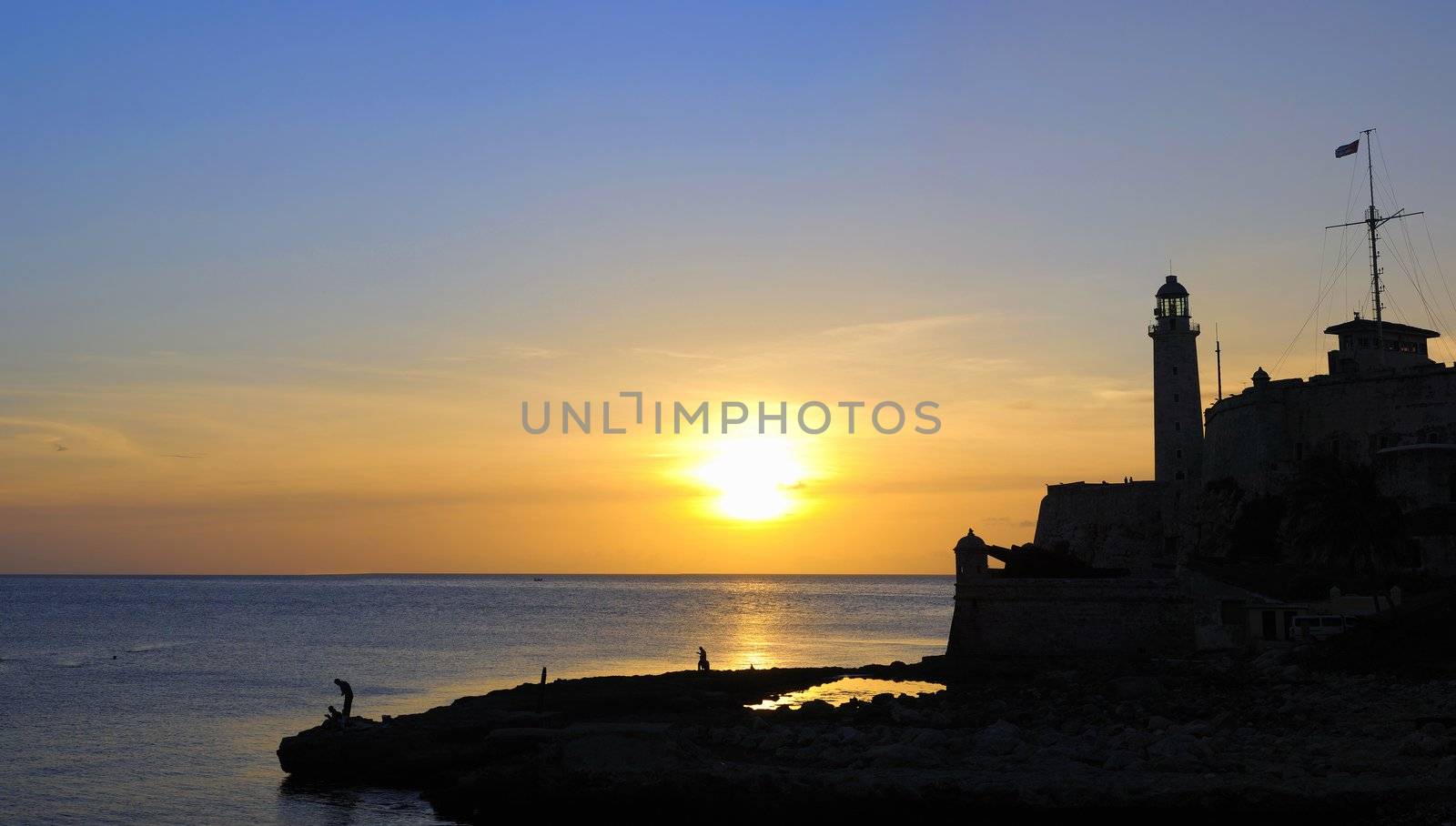 Panoramic view of Morro fortress silhouette at sunset in havana, cuba