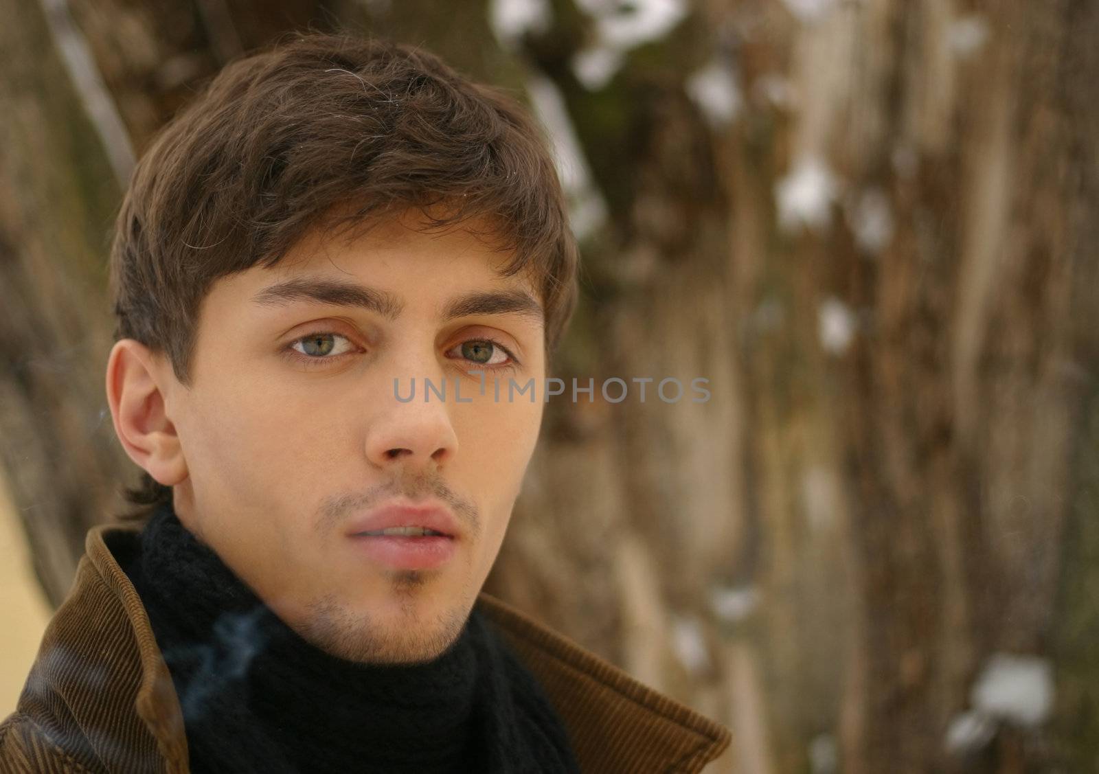 Portrait of the young man in the winter