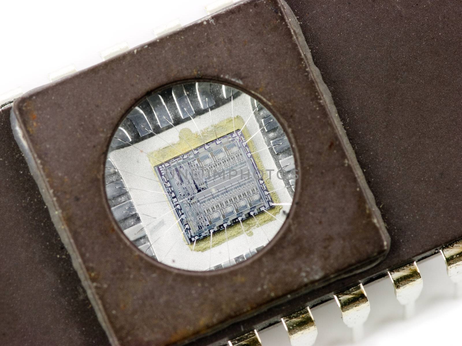 EPROM memory microchip with a transparent window, showing the integrated circuit inside
