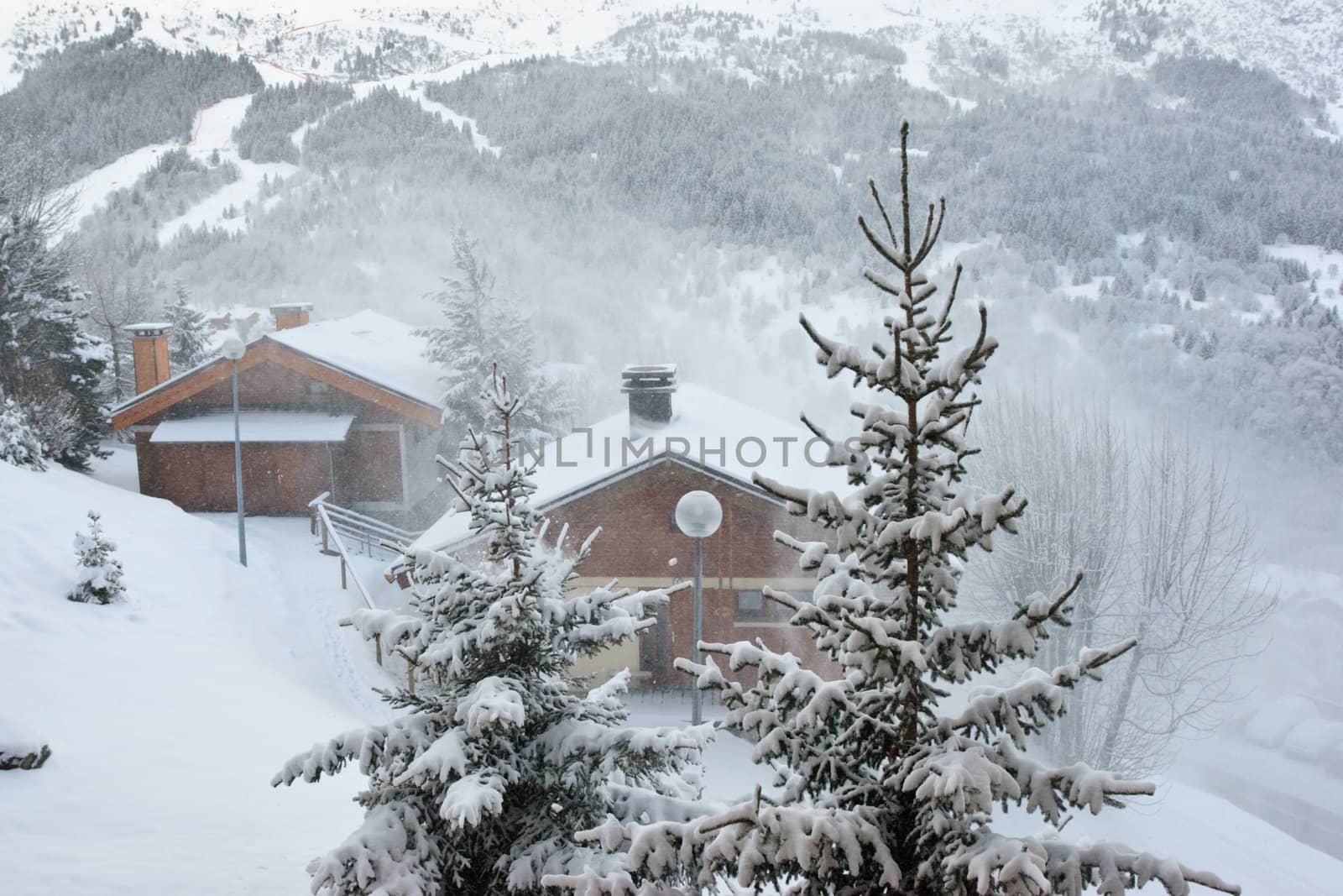 Ski resort at snow storm, Meribel, Trois Vallees, France