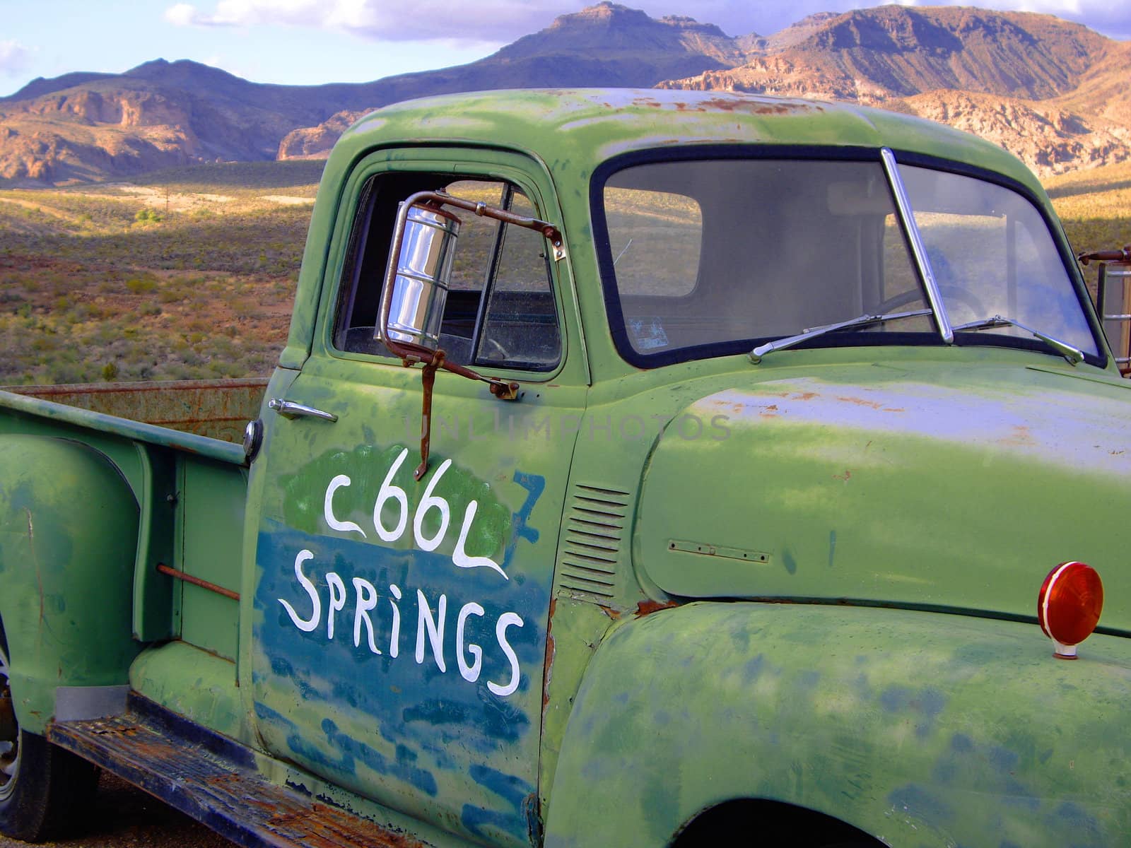 Old green pick up truck  on Route 66 USA