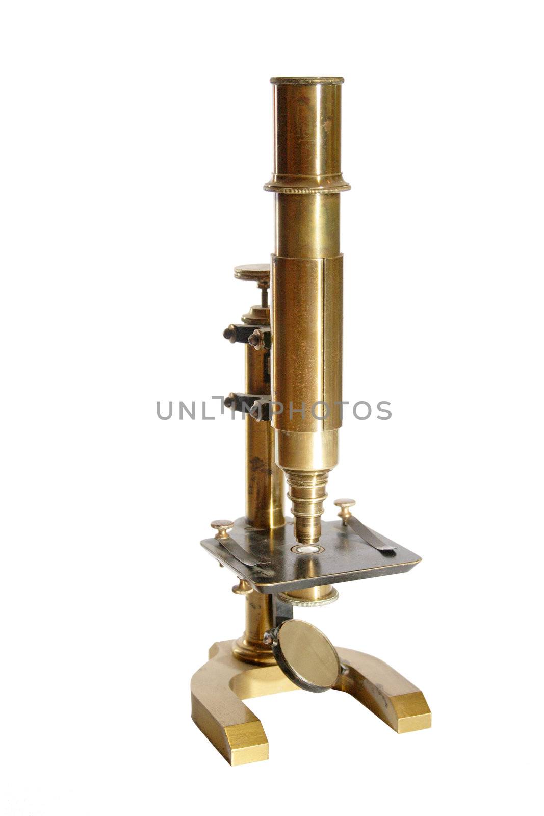 Old microscope isolated on white background