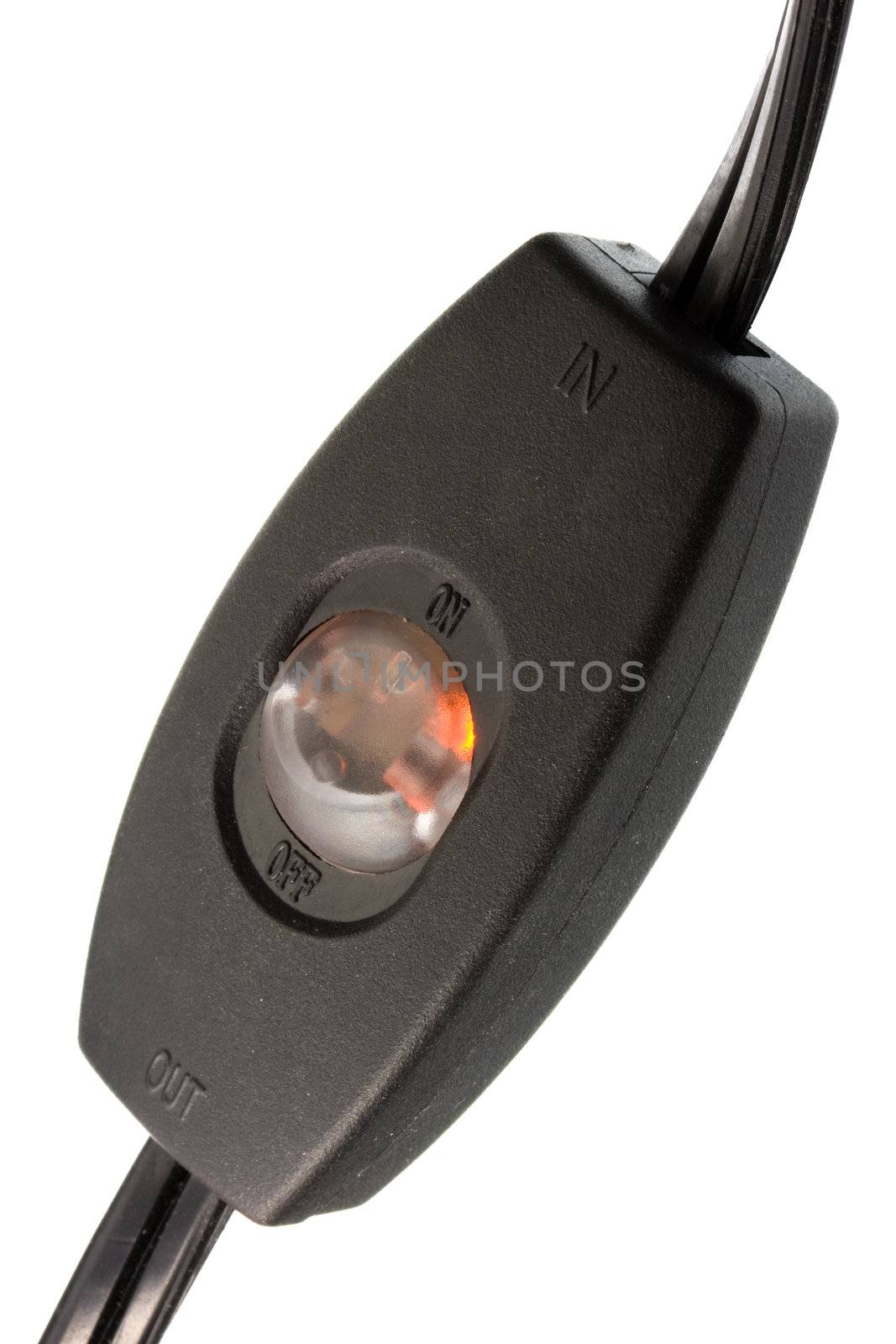 black plastic in-line electric cord switch with LED orange light: off and on, in out out marks, isolated on white