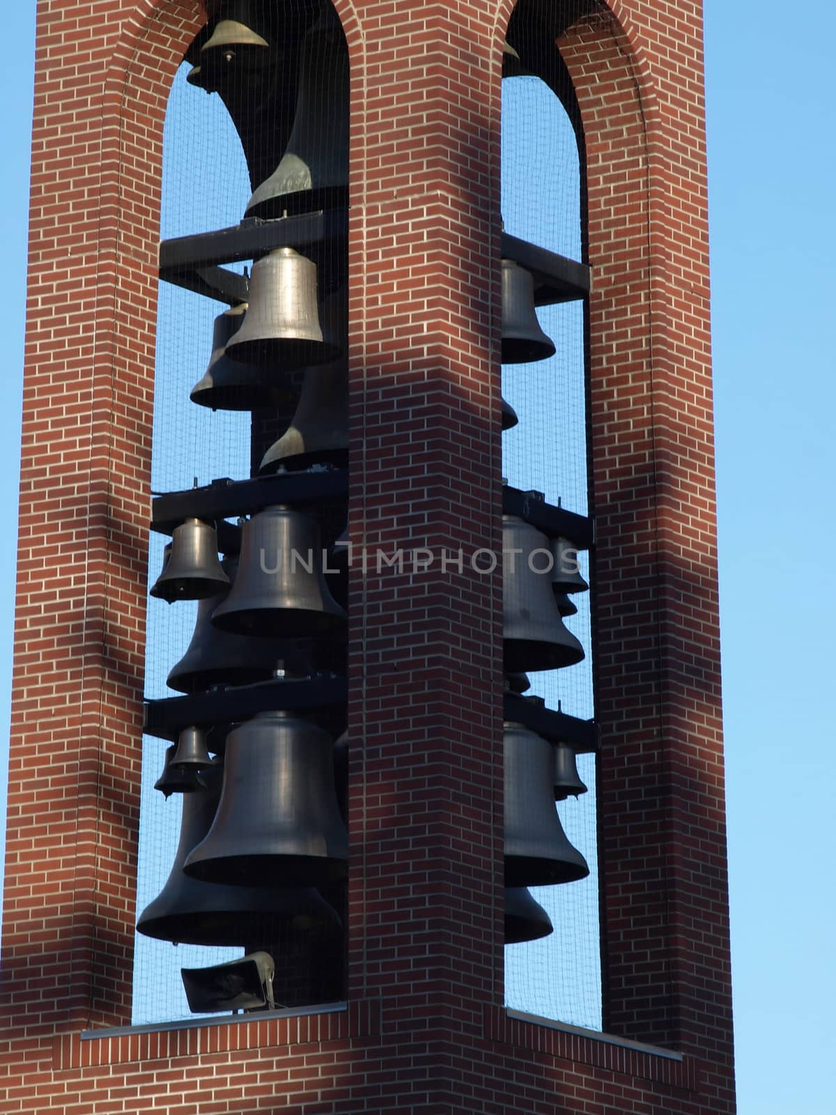 Close up of bells in a bell tower in a town square.