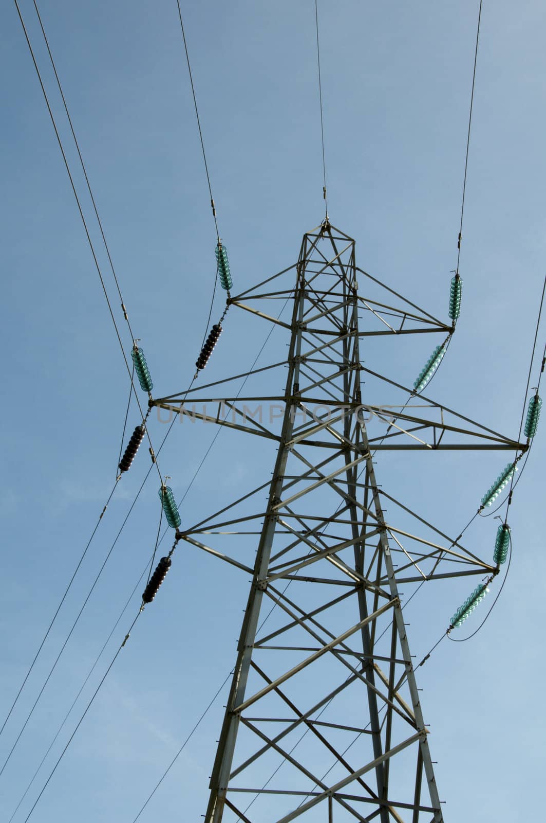 A electrical pylon with a blue sky