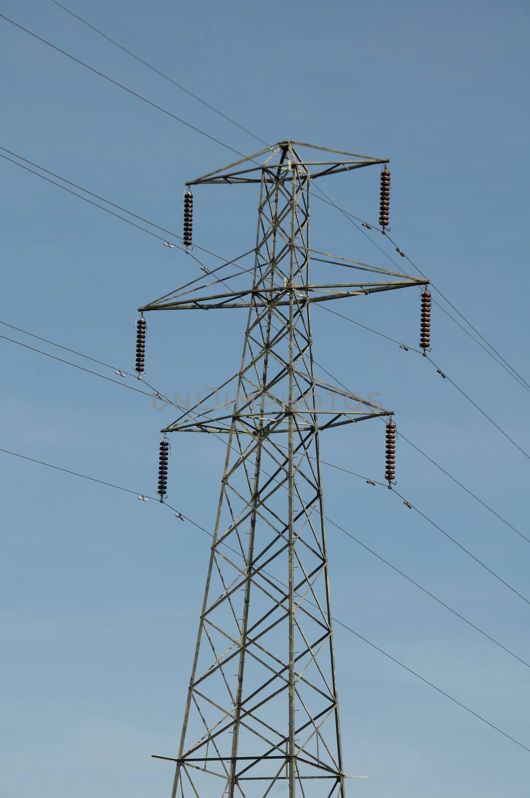 A electrical pylon with a blue sky