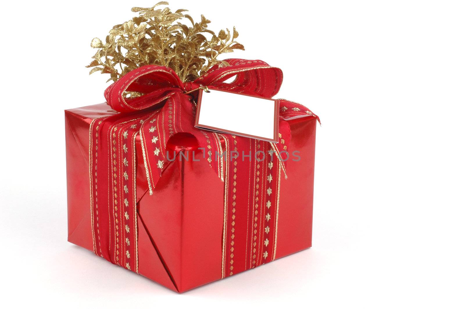 Beatifully wrapped present in red and gold.