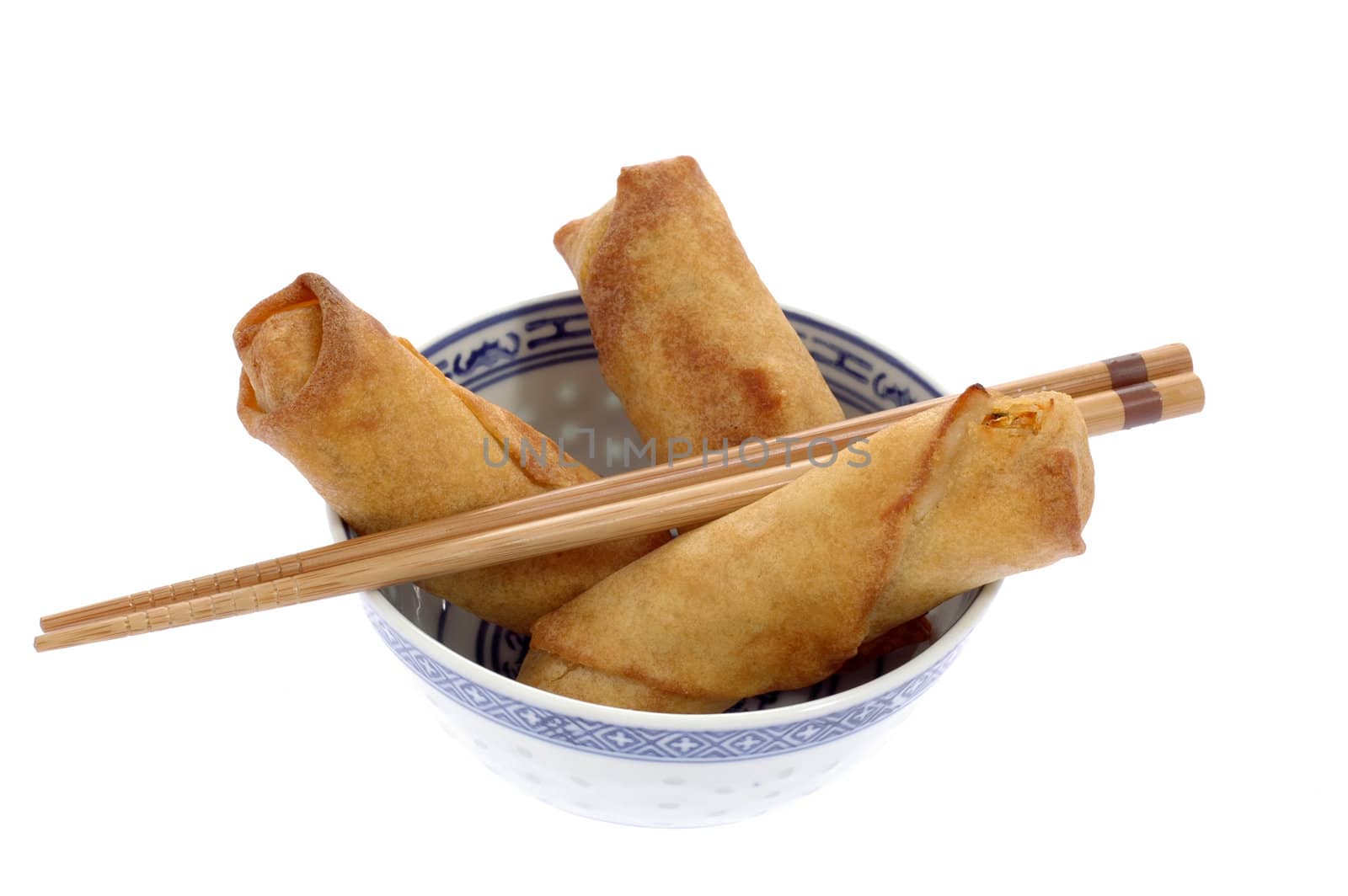 Vegetable filled Chinese spring rolls in a bowl.