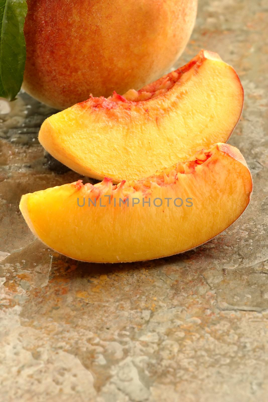 Fresh peach slices by carterphoto