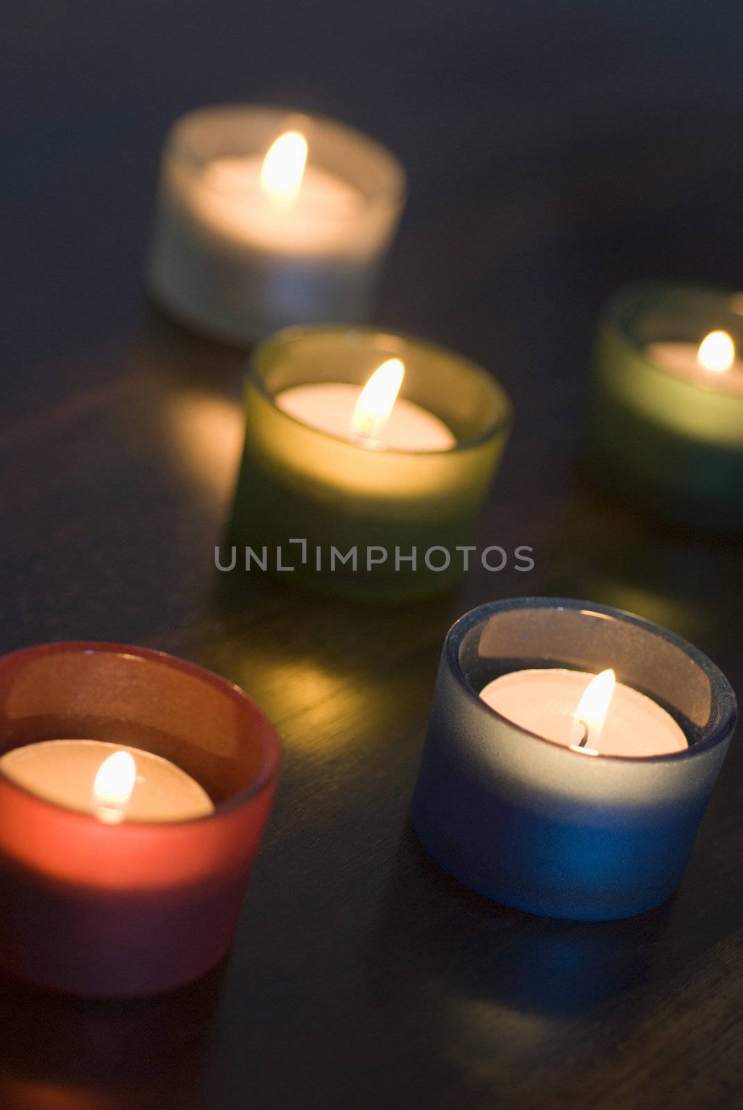 a set of 5 tea light candles with a narrow depth of focus, representation of Diwali