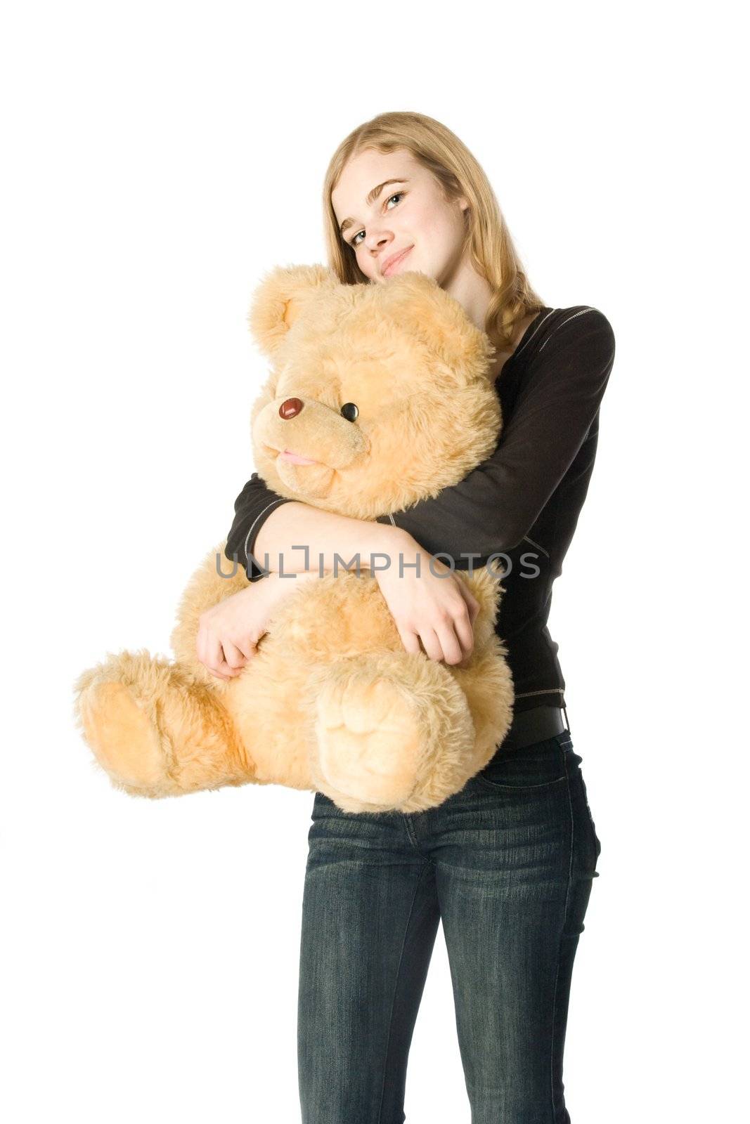 Young girl hugging a Teddy bear, isolated