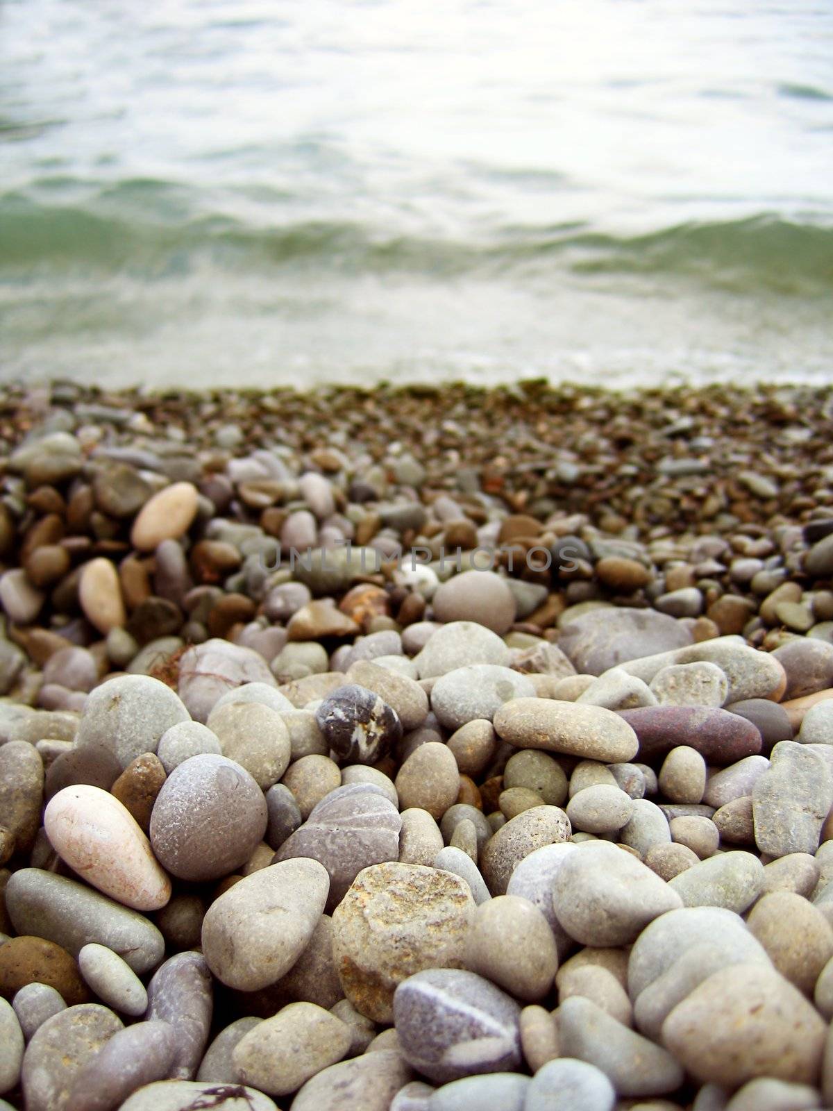 Sand stone background on the beach and sea