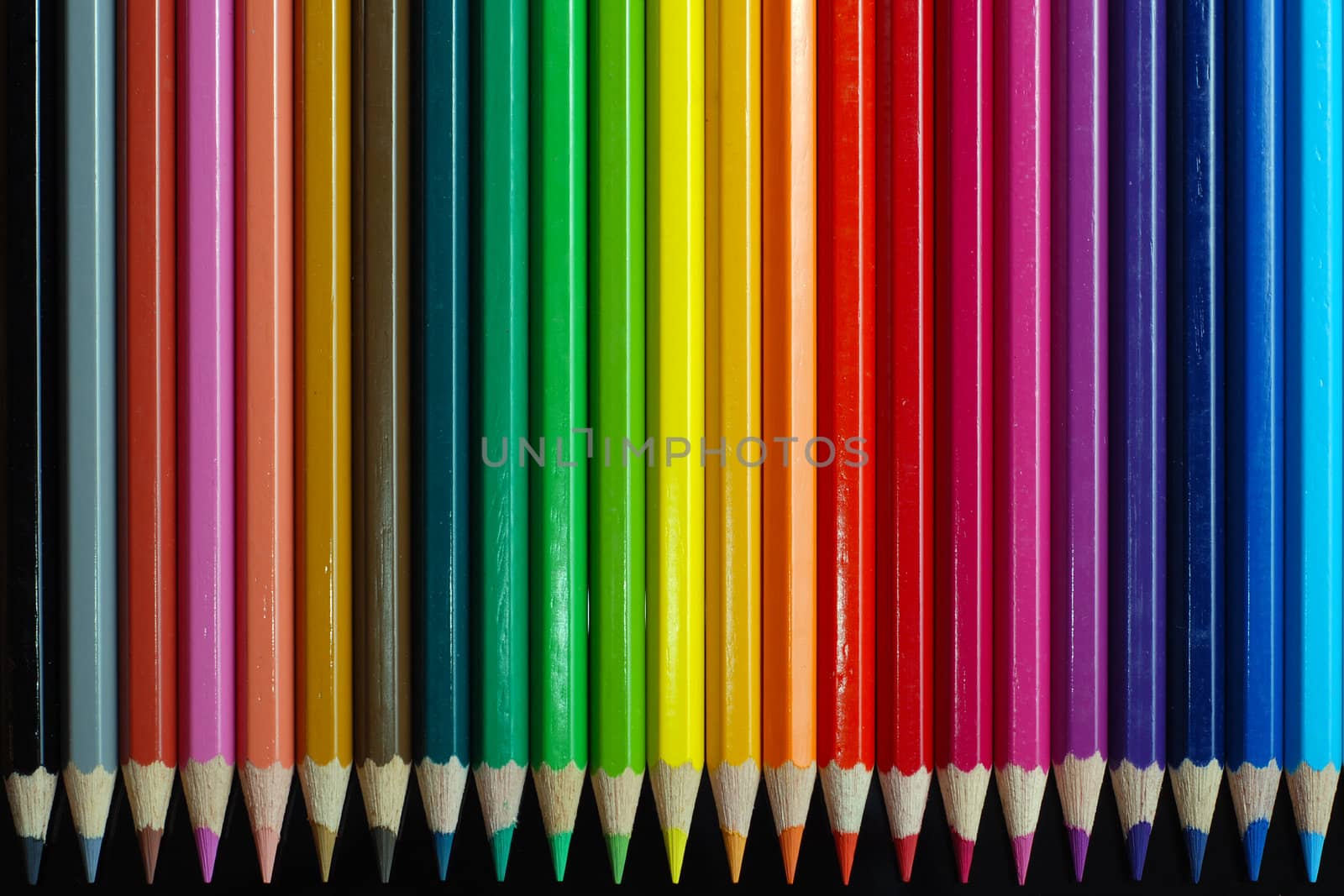 Color pencils on black background 