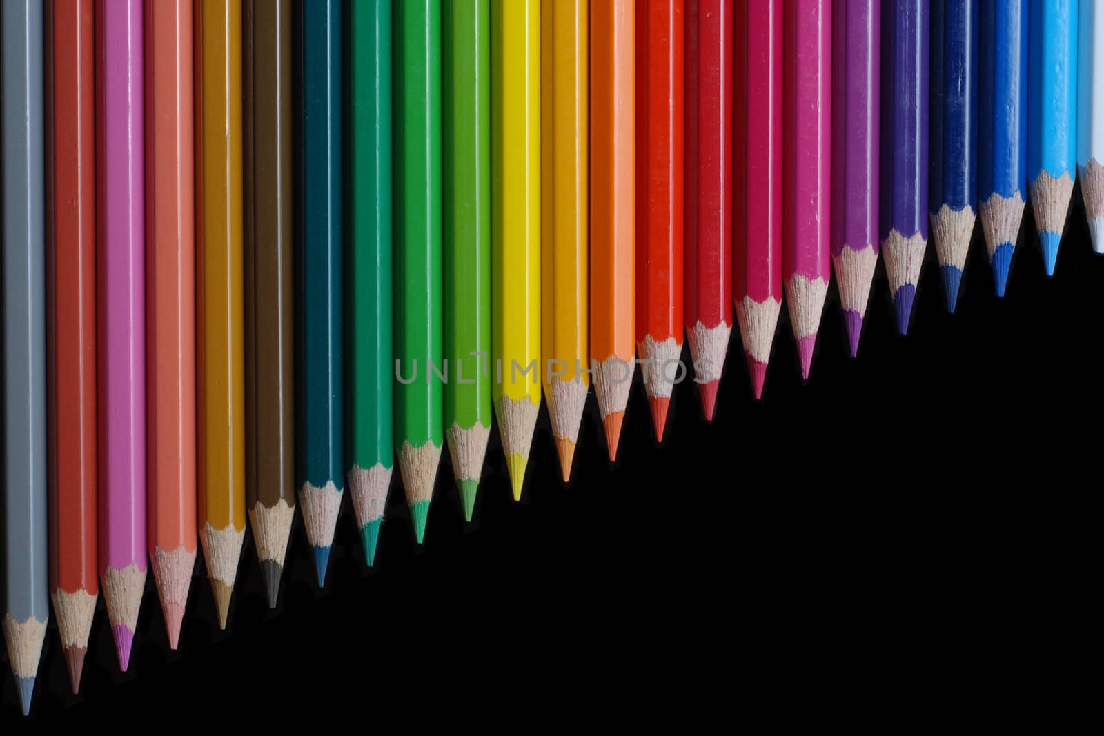 Color pencils on black background 