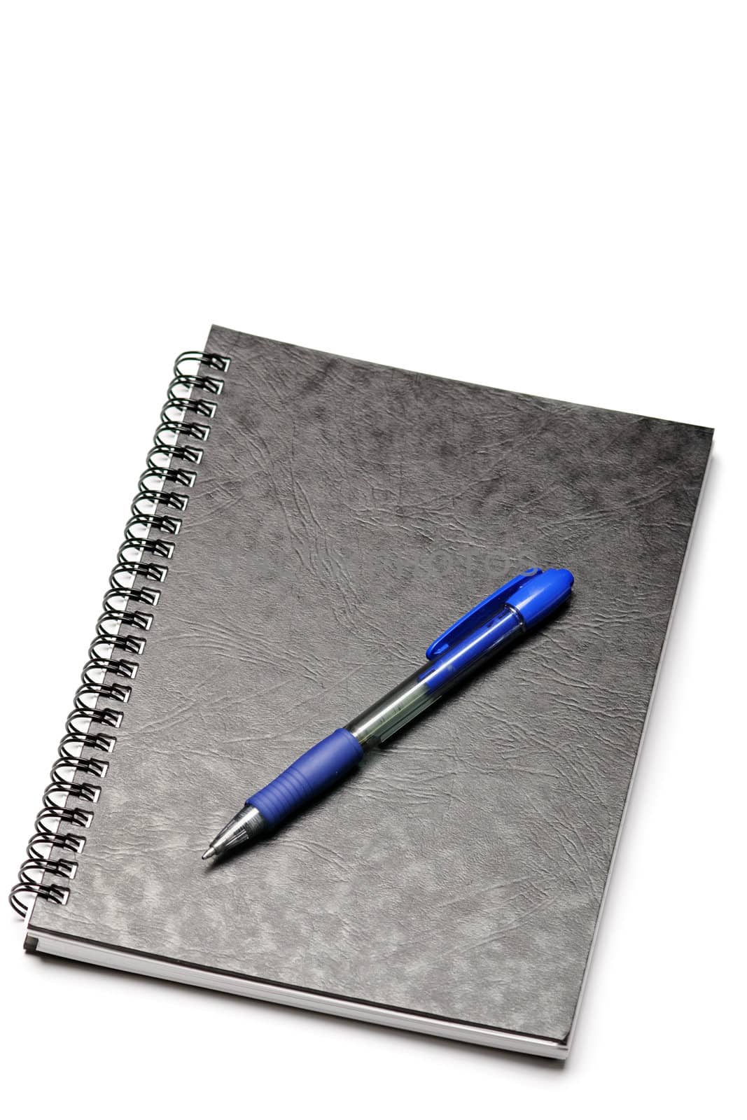 Black spiral notebook and pen isolated on white backround