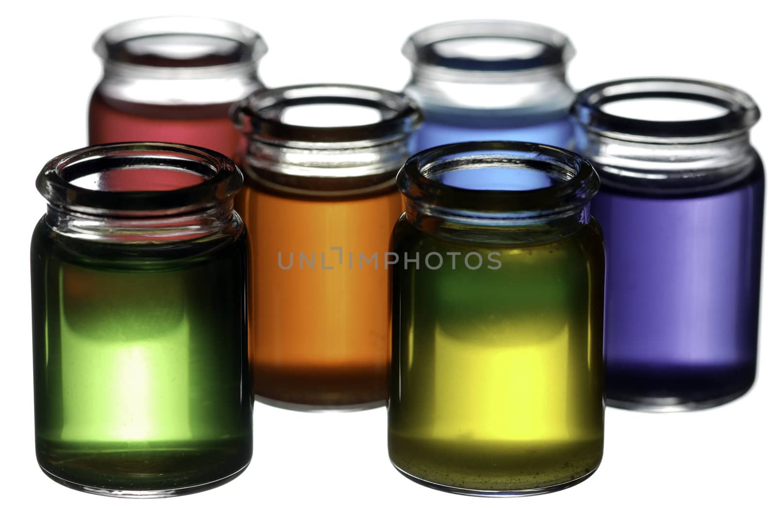 Group of glasses filled with colorful liquid isolated on white