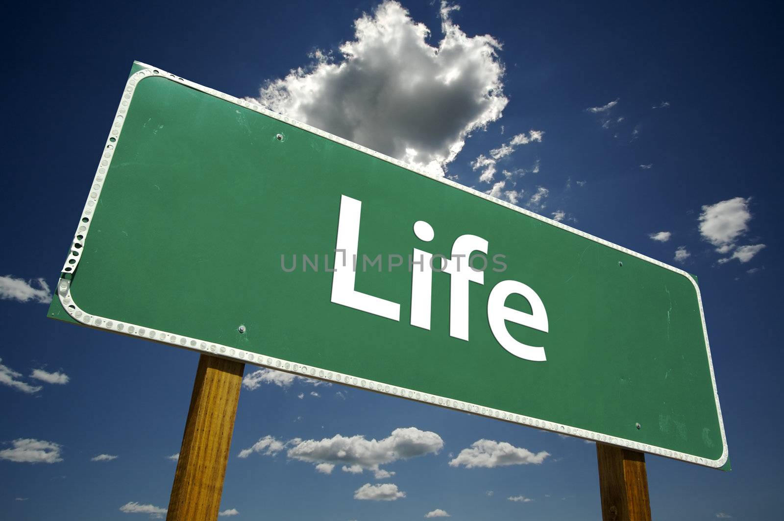 Life Road Sign with dramatic clouds and sky.